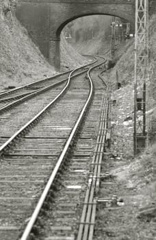 vintage railroad merging from double to single track