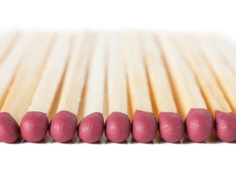 Macro view of row of matches isolated over white