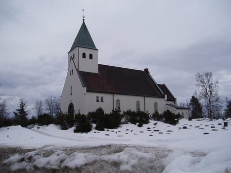 Raufoss Kirke er en langkirke fra 1939 bygget i teglstein og tre ( Arkitekt 
Henry Bucher )