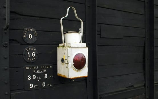 old style warning lantern on a vintage boxcar