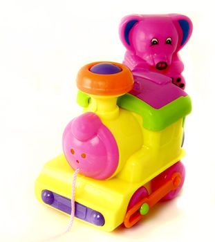 plastic toy train with a small teddy 