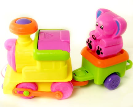 plastic toy train with a small teddy 