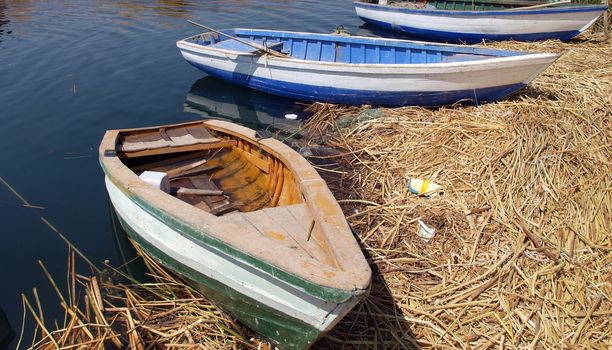 local motorboats, floating island, titicaca lake