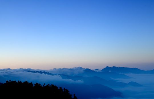 It is the black mountain with blue sky.