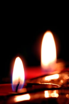 romantic candle flames against black