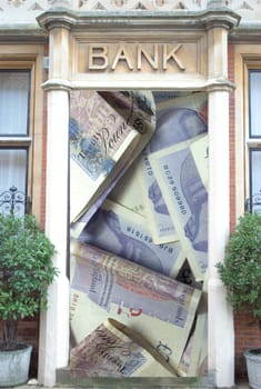 Bank with twenty pound notes in door