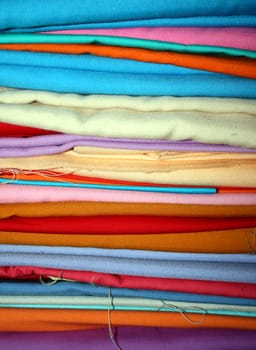 A stack of colorful fabrics.