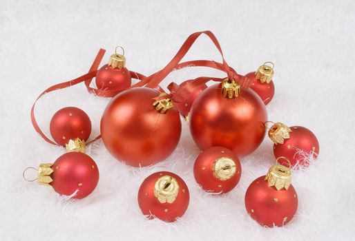 Christmas red spheres on the white fur
