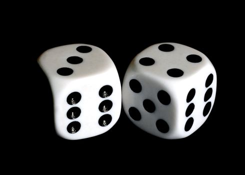 Close up of a pair of dice with seven and eleven showing.