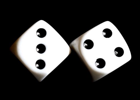 Close up of a pair of dice with seven showing.