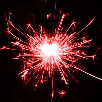 burning sparkler in the shape of a heart