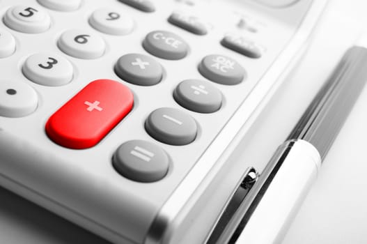 business calculation concept with modern white calculator