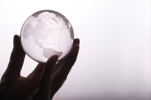 globe in hand isolated on white showing eco environment or business concept