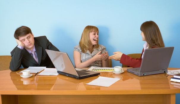 Young businessman has fallen asleep sitting at meeting