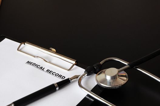 medical record clipboard and stethoscope showing health or medicine concept