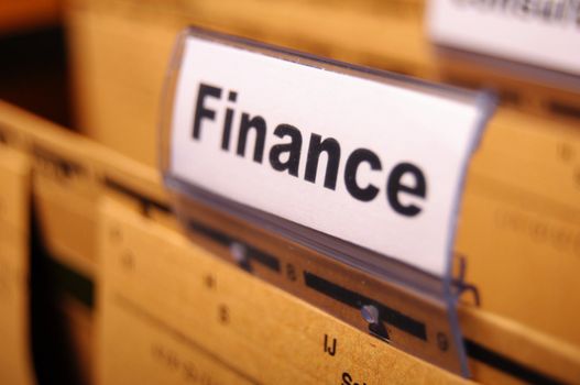 finance on business office folder showing financial success concept