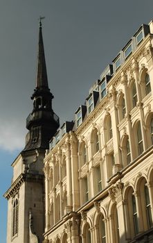 dark clouds over a gothic church spire in london