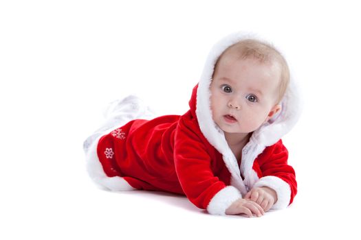 Little christmas baby looking a little bit surprised on white background