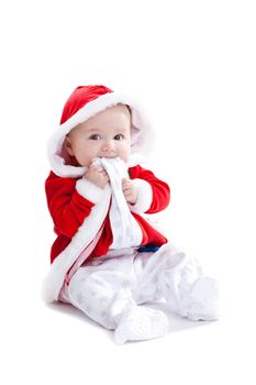 Adorable young baby girl with a cute santa suit on