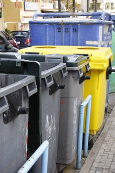 refuse bins with recycle bins in the streets