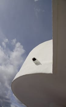 balcony curves and straight lines against the sky