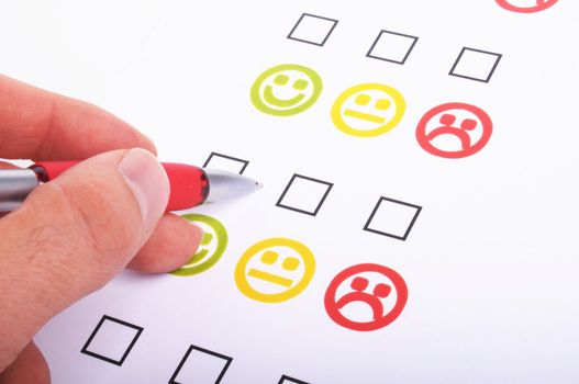 hand pen and checkbox or tickbox with smilie