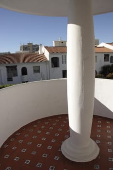 balcony and column support overlooking a swimming pool