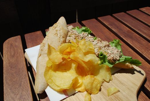delicious tuna sandwich with potato chips
