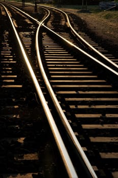 Railway junction glowing in the sunset