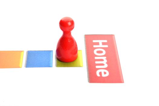 getting home concept with word and pawn on white