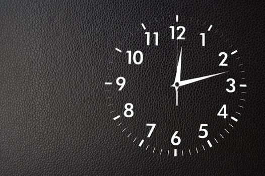 clock or watch on a wall with copyspace showing time concept