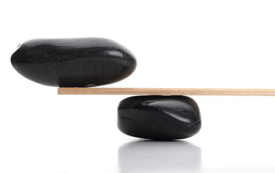 zen stones scales isolated on white showing weight or spa concept with copyspace