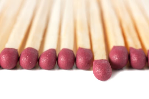 Macro view of row of matches isolated over white