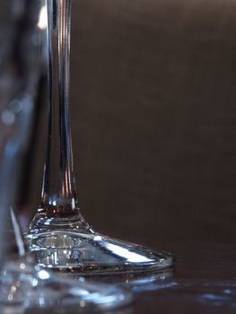 tall glass stems on a wooden table