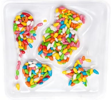 Colour sweetmeats in glaze on transparent plastic form