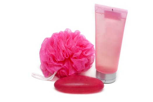 Rose sponge, red soap and tubes helium on white background
