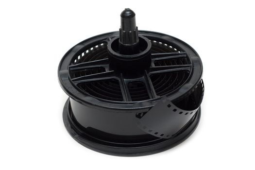 Spool for proappearance with negative monochrome film on white background