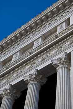 detail of a building showing its corinthian pillars