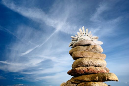 Symbol of the Sun on the top of the pyramid of stones