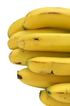 An isolated bunch of ripe yellow bananas.