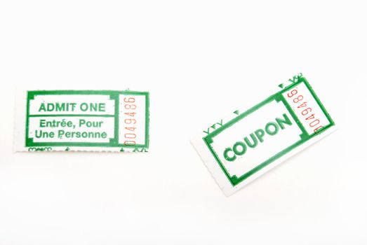 A couple of green ticket stubs on white background.