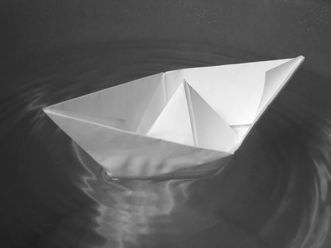 Paper ship in water