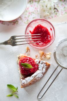 Delicious cheesecake with raspberry coulis and mint