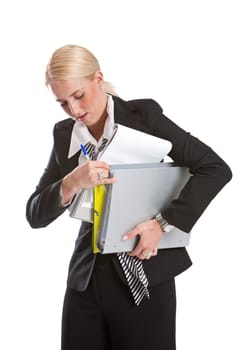 Pretty blond business woman struggling with papers under her arm