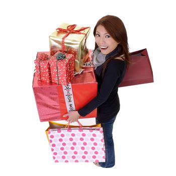 Modern young woman holding bags and gifts with smiling and happy expression isolated over white.
