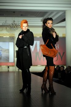 SIEDLCE, POLAND - NOVEMBER 19: models showcasing designs from Ochnik leather collection walk the catwalk at the Siedlce Fashion Evening on November 19, 2010 in Siedlce, Poland