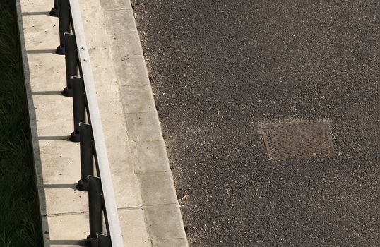 freeway crash barrier and tarmac road