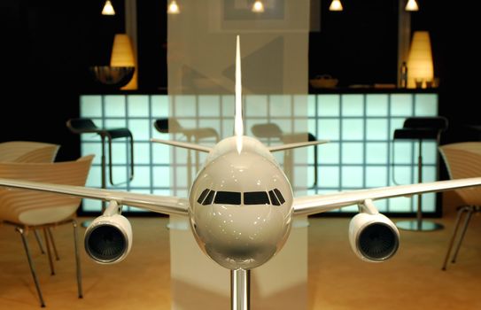 large scale model aircraft in an interior surrounding