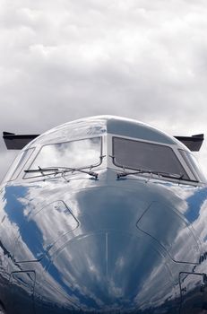 business jet close-up against a cloudy sky