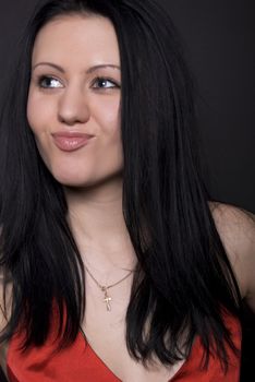  Portrait of a young seductive brunette over black